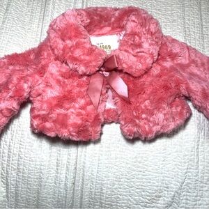 1989 PLACE Little girls coat. Pink fur 1 button, bow accent Size 24 months